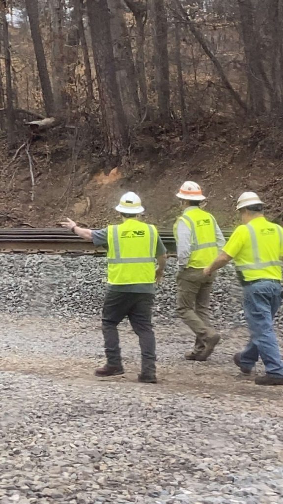 Men inspecting land grading project